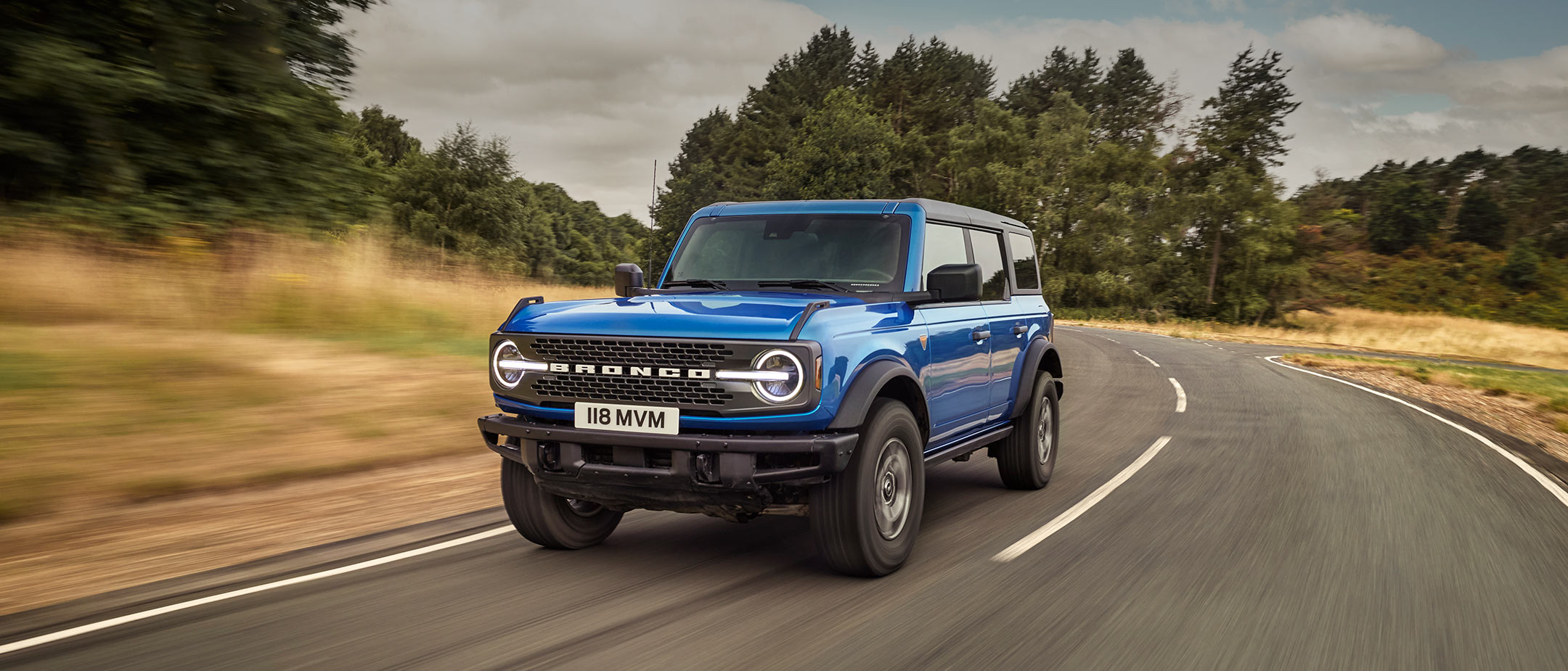 Ford Bronco driving on a road