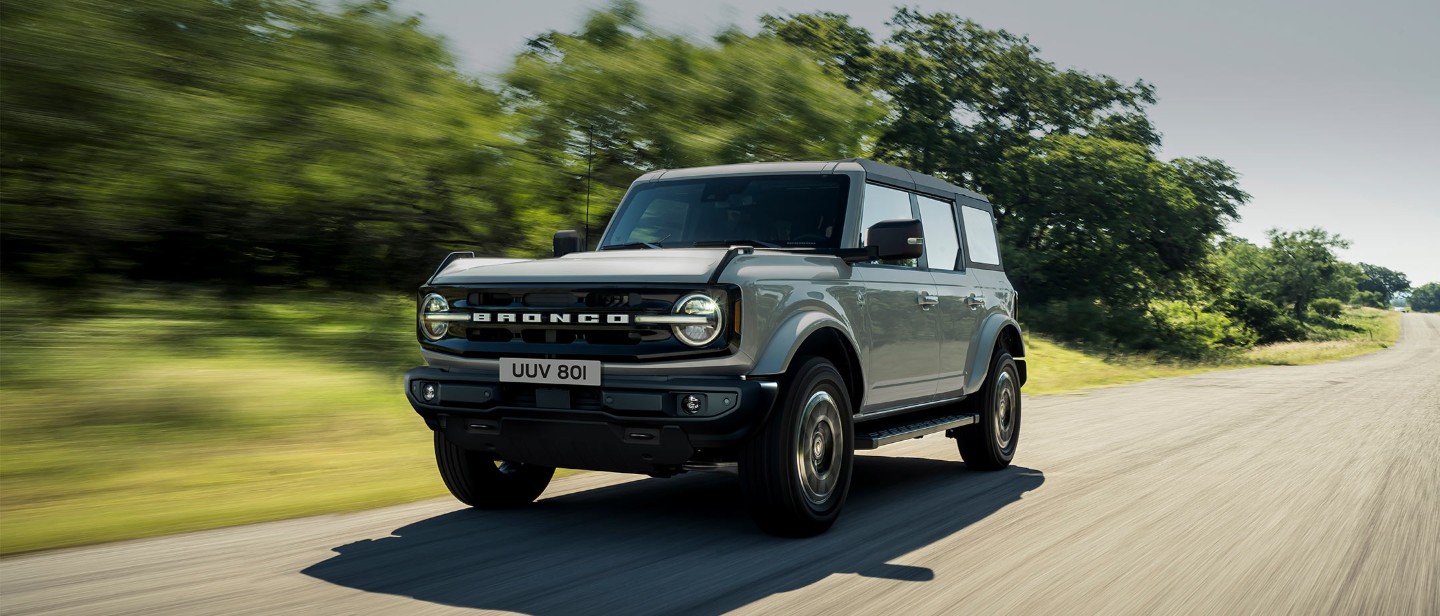 Ford Bronco driving on a road