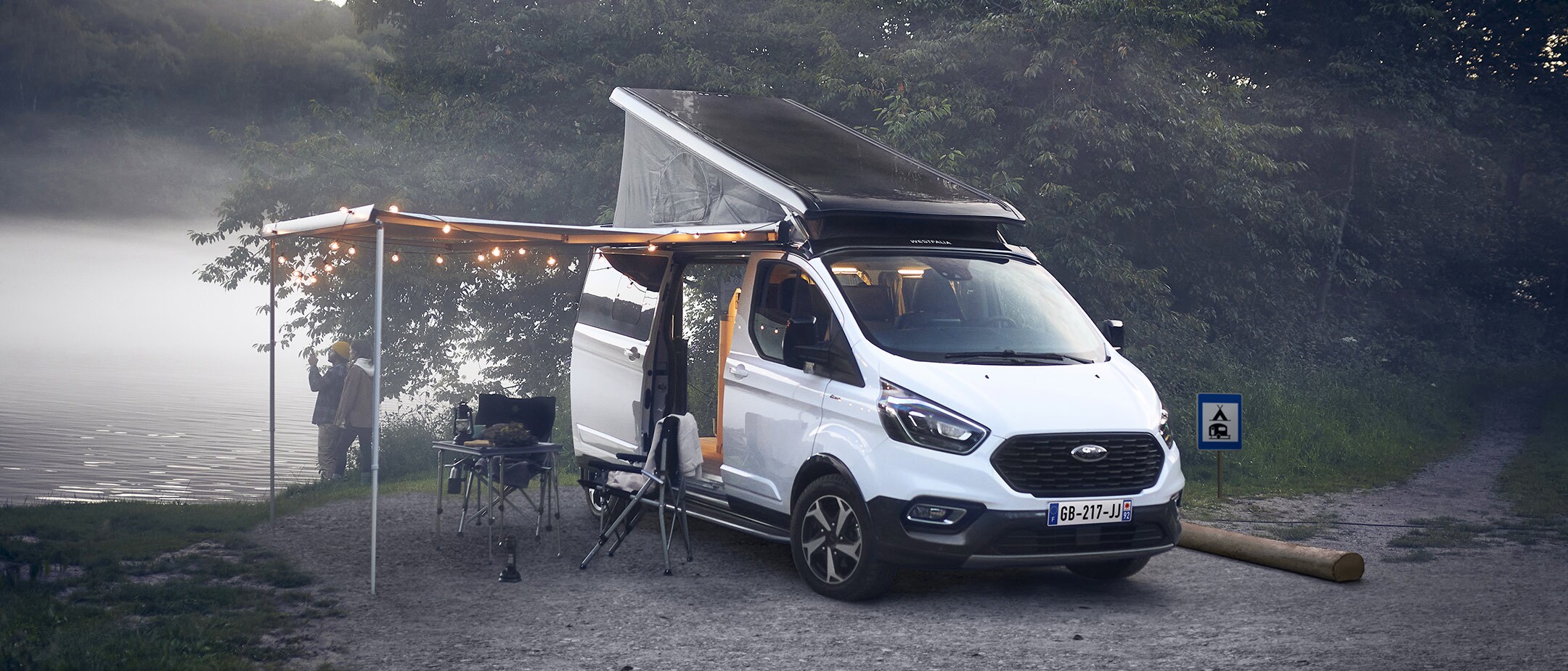 Ford Transit Custom Nugget with couple camping
