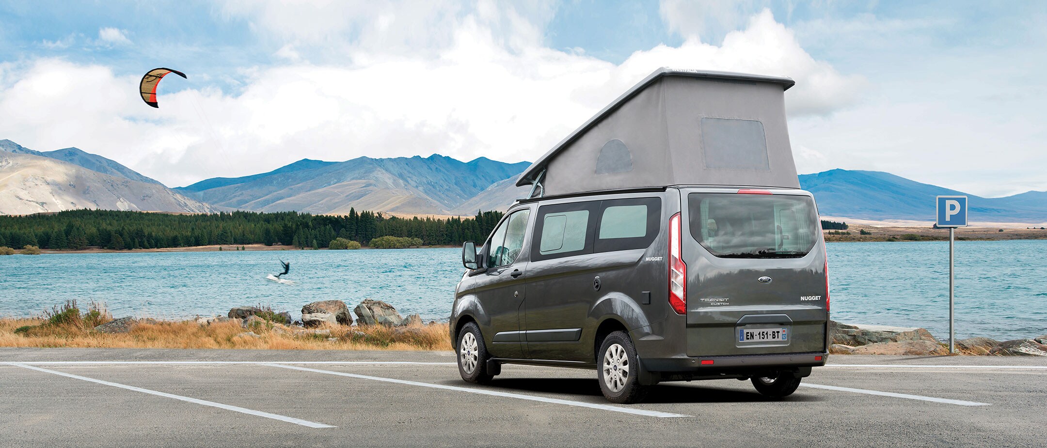 Ford Transit Custom Nugget with couple camping