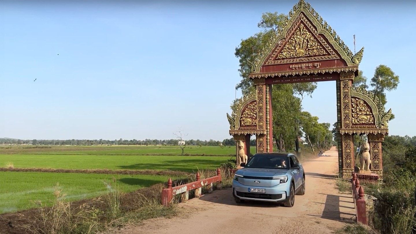 Ford Explorer driving through a gate in Cambodia