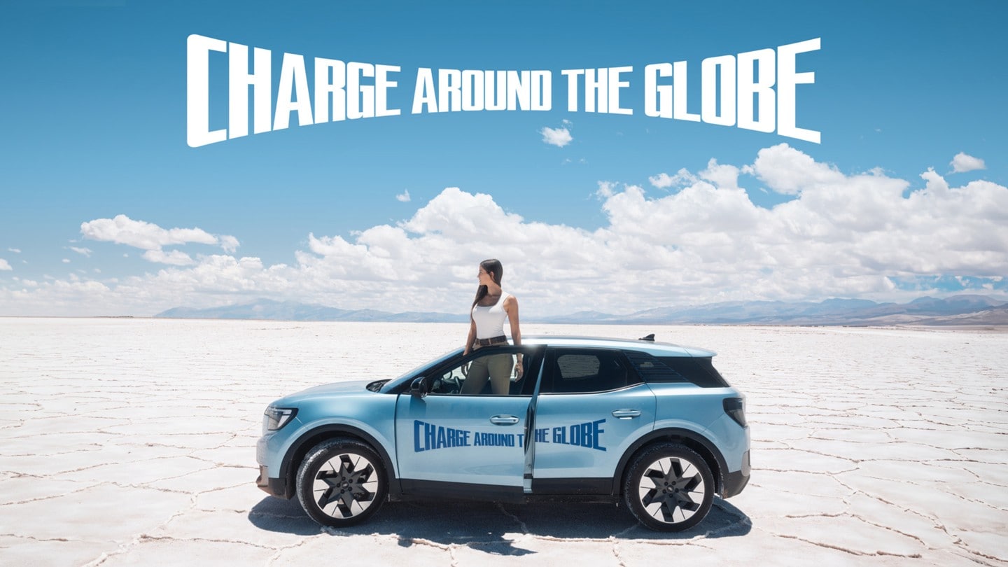 Lexie Alford, (AKA Lexie Limitless), standing in a desert with the New Ford Electric Explorer