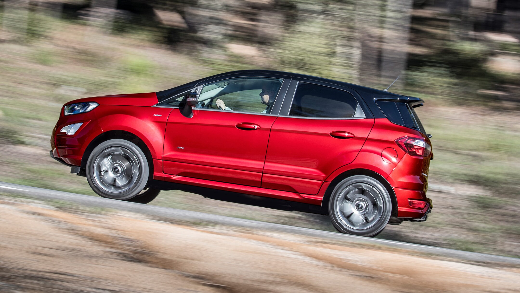 Red Ford EcoSport driving upwards