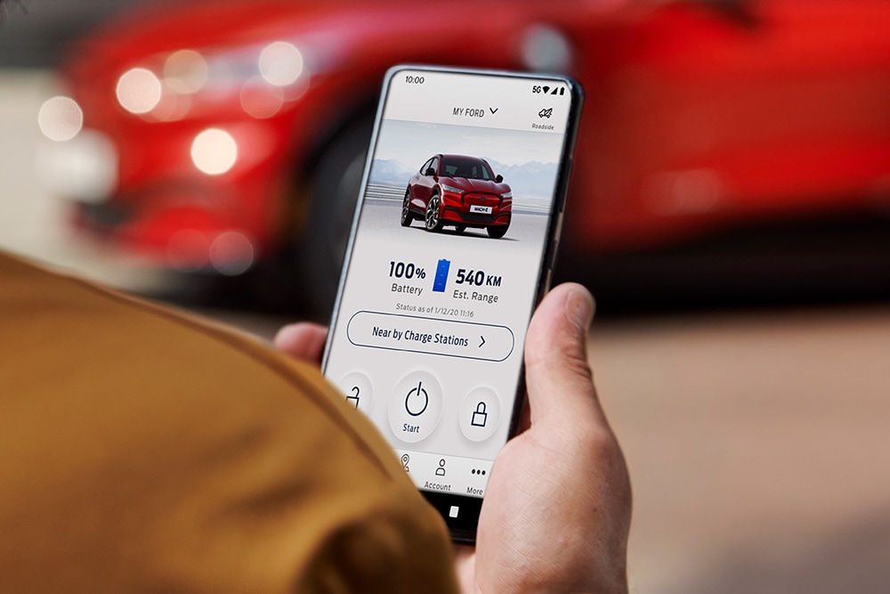A person using the FordPass app on a smartphone