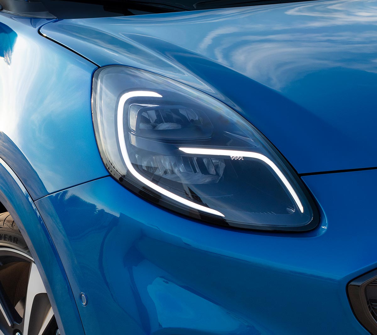 New blue Ford Puma close up on headlights