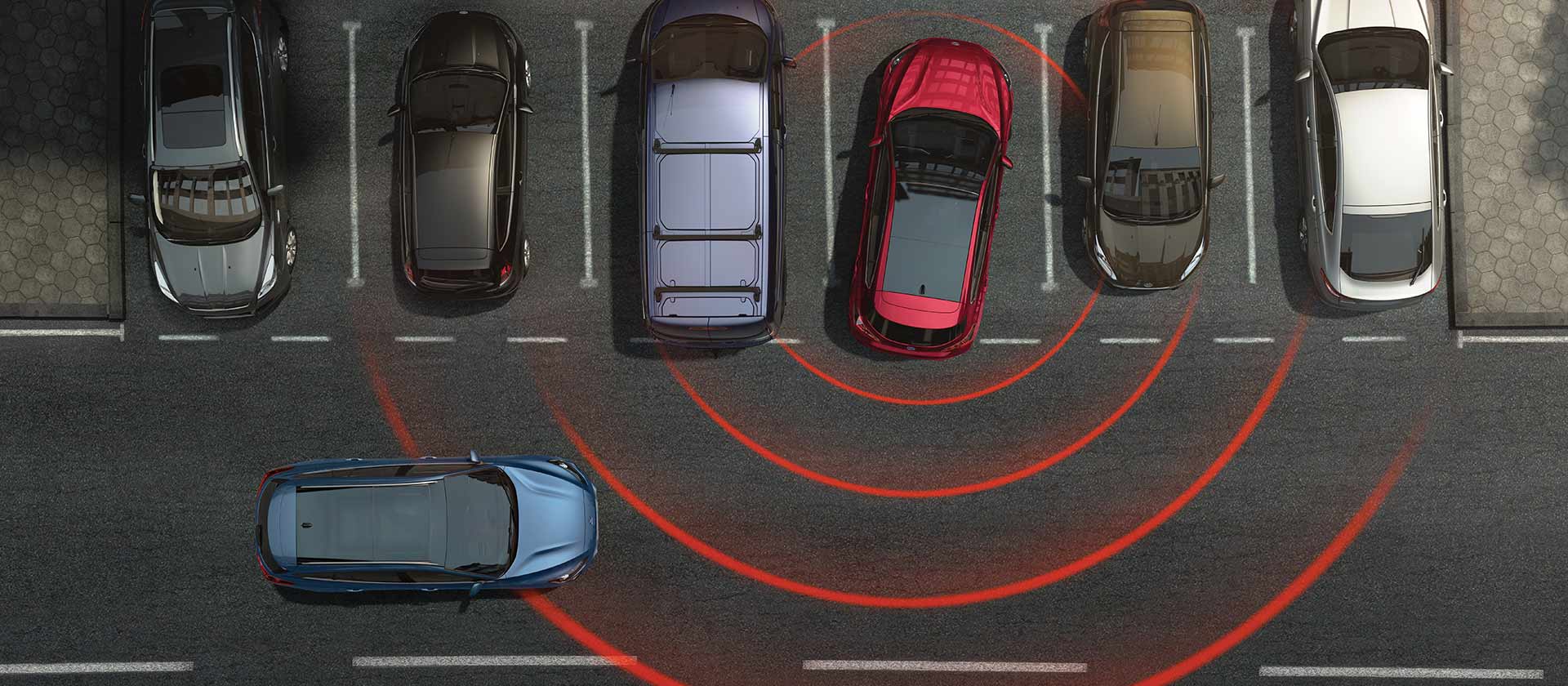 Graphique de haut en bas montrant une rangée de places de parking. Les lignes radar représentent une alerte dans la Ford Focus rouge en marche arrière, indiquant un danger proche.