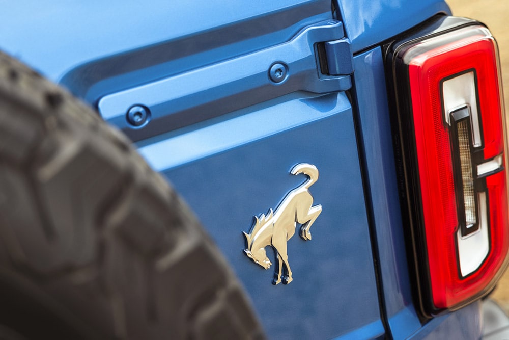 A close up on the branded details on the rear of a blue Ford Bronco.