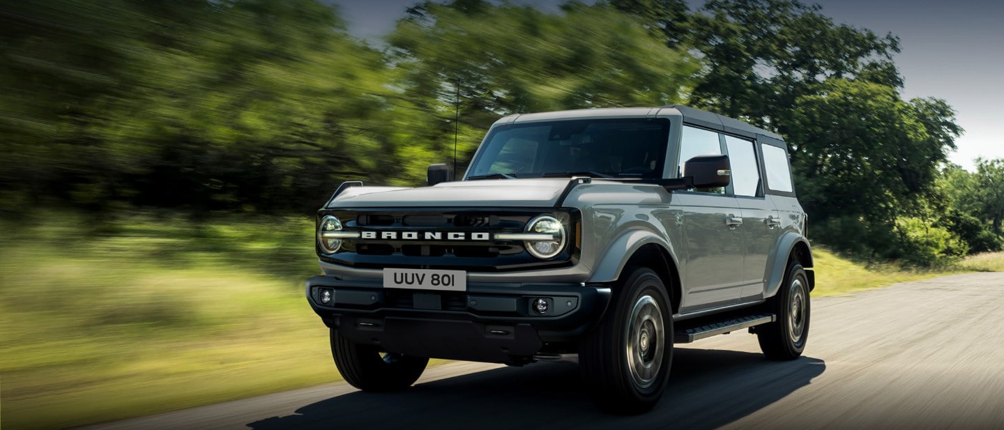 Ford Bronco driving through river Ford Bronco driving through river