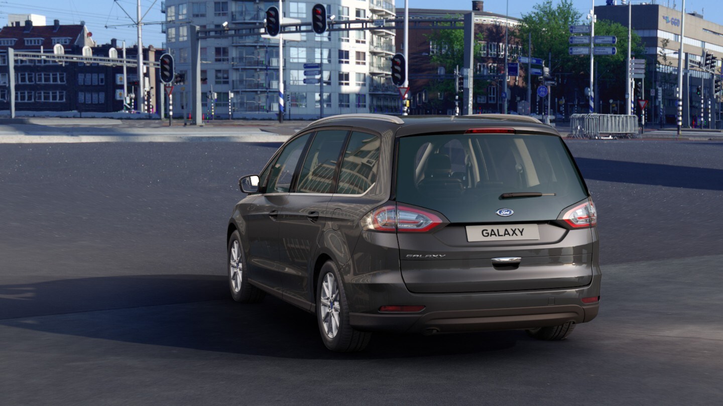 Grey Ford Galaxy standing on red lights rear view