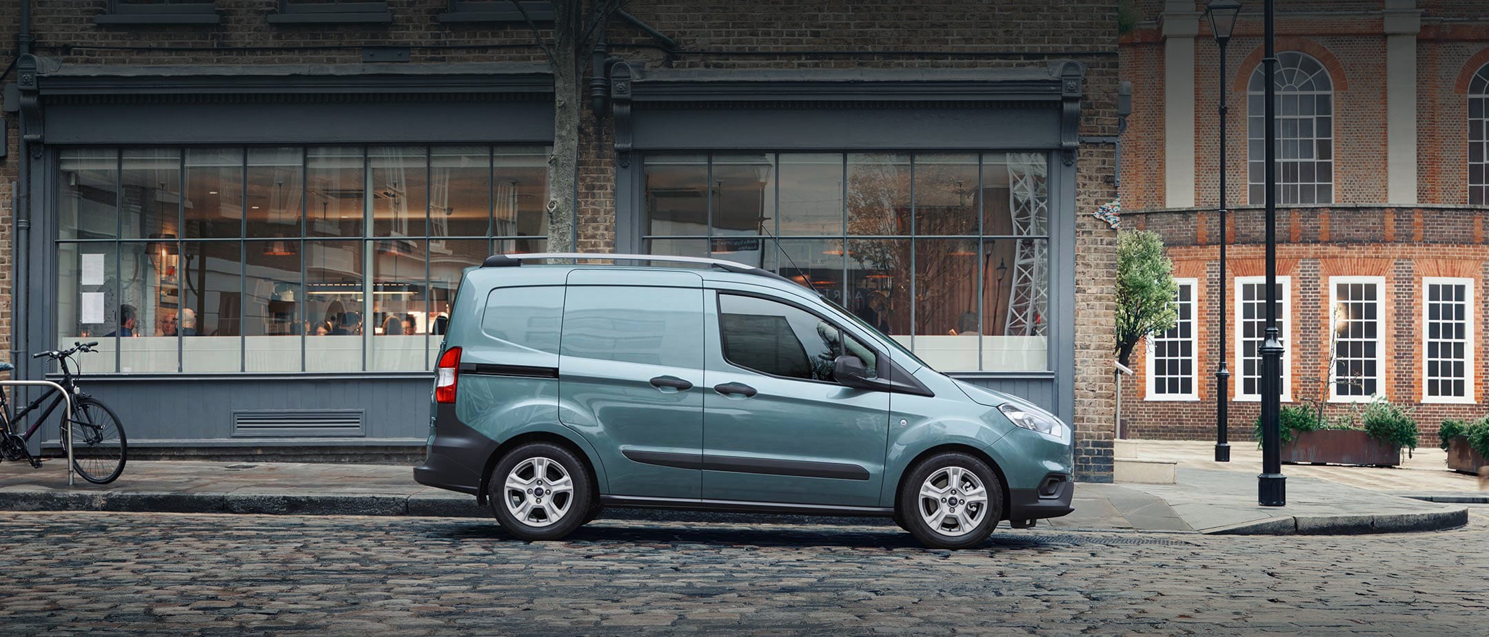 Ford Transit Courier parked on cobbled street