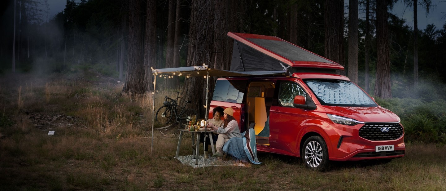 All-New Ford Transit Custom Nugget in forest with people camping