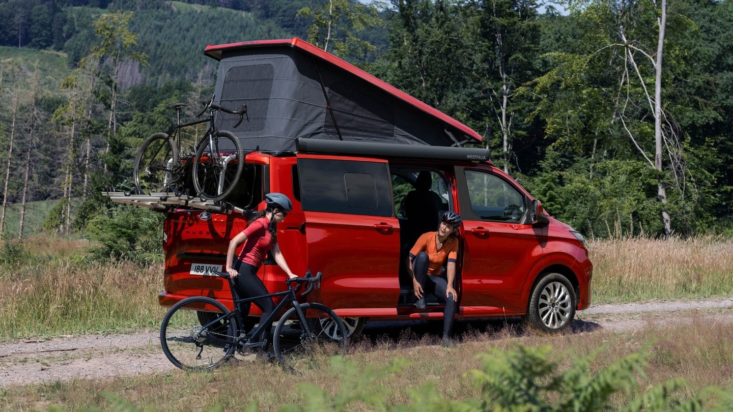 All-New Ford Transit Custom Nugget with cyclist and bike rack at the back