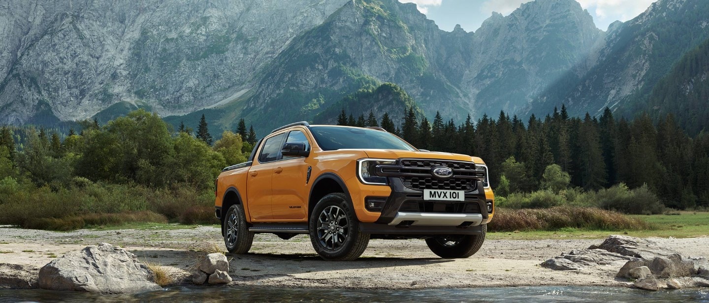 All-New Ford Wildtrak parked near mountains 3/4 front view