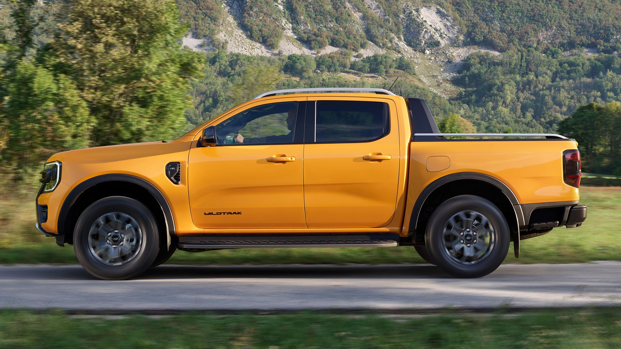 All-New Ford Ranger side view driving on county road