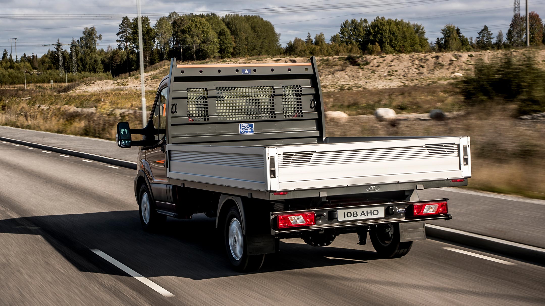 Transit Chassis Cab on highway in motion view from back