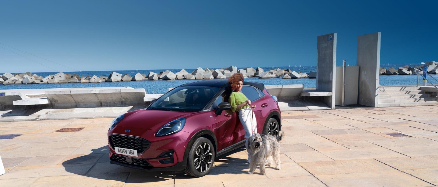 Crimson Puma with a woman and a dog on the side