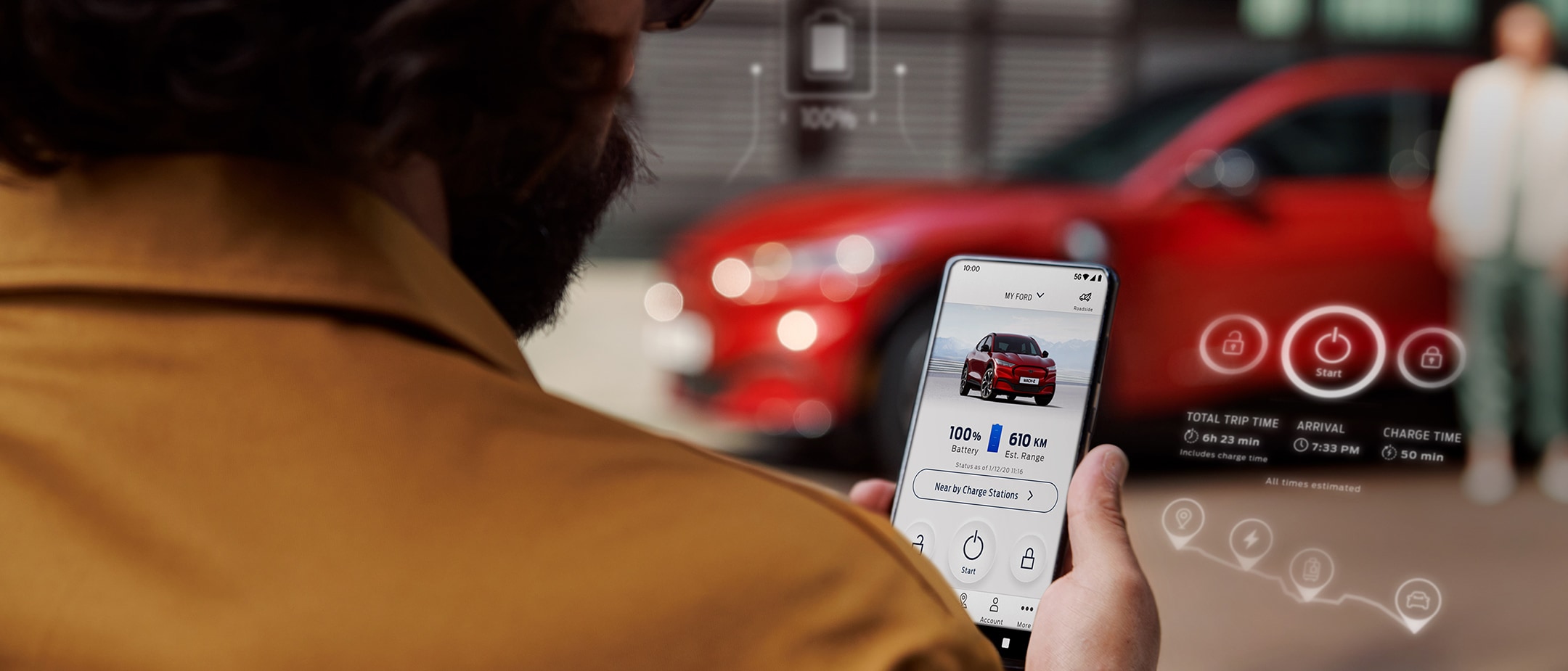 Man holding mobile with FordPass app