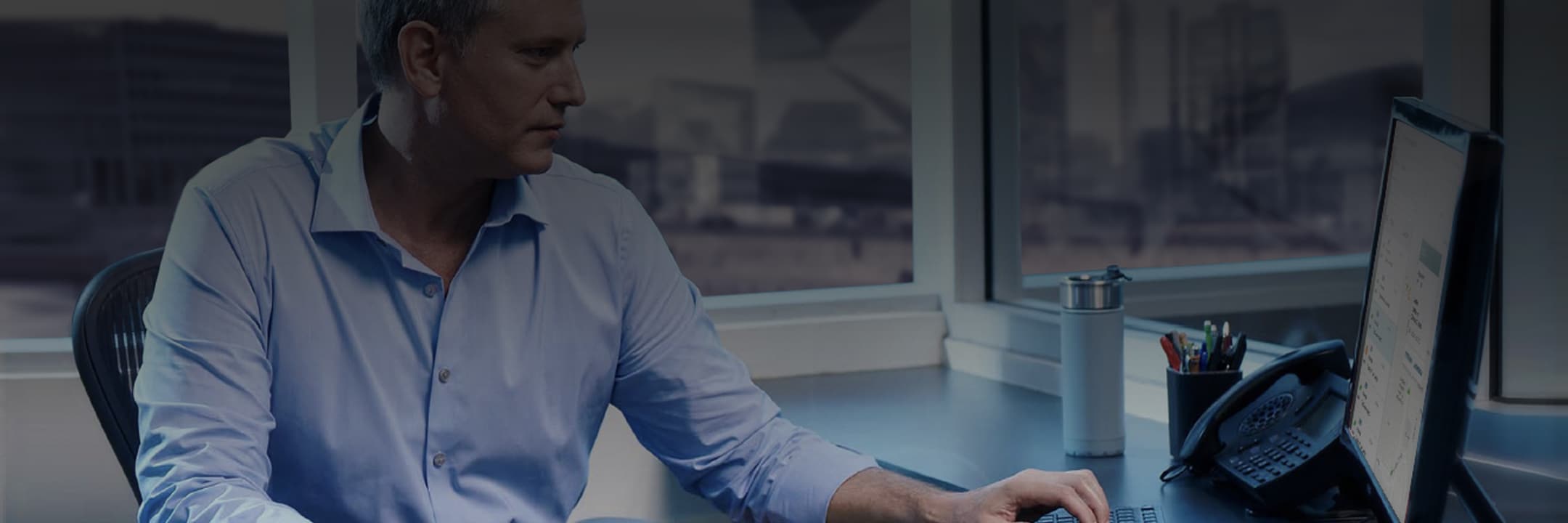 Man checking the status of a Ford Fleet